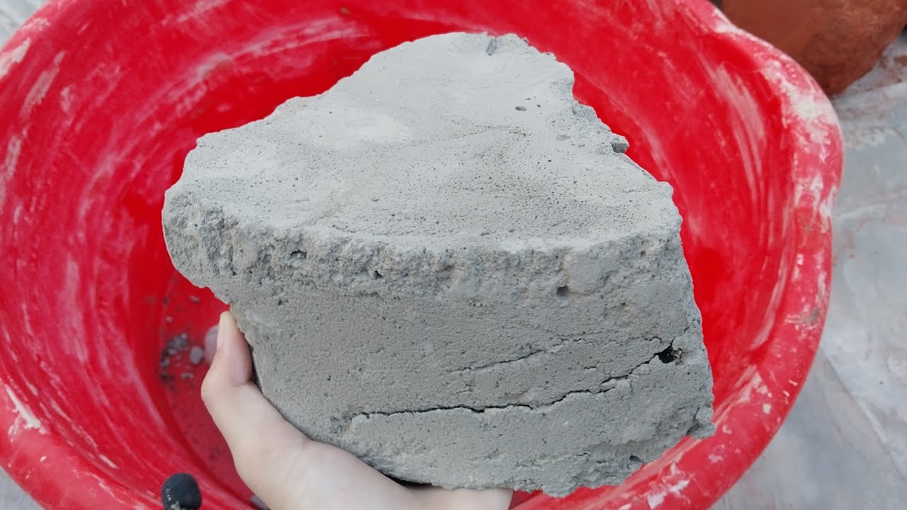 Black dirt chunks dry crumbling in tub Satisfying sound