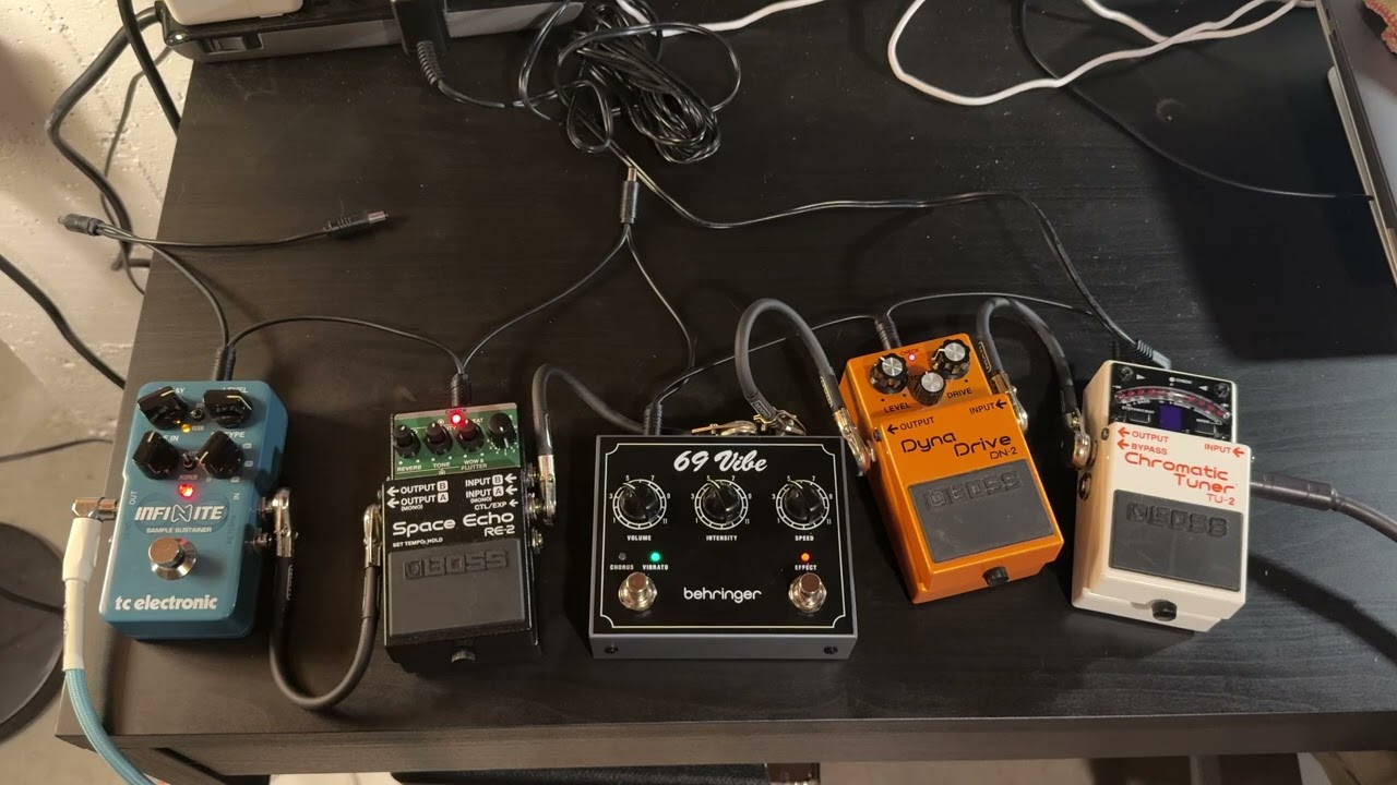 Behringer ‘69 Vibe, Boss RE-2 Space Echo, Boss DN-2 Dyna Drive and TC Infinite Sustainer.