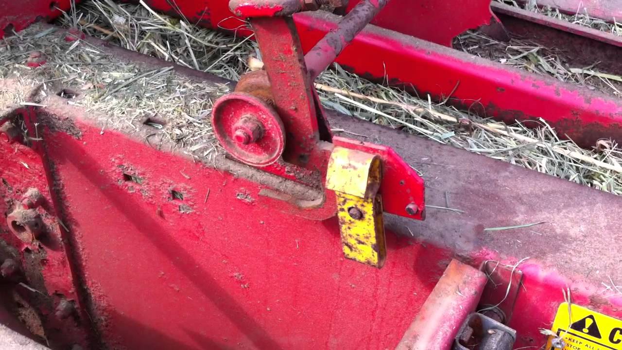 MF 124 Hay Baler's Knotter in action!