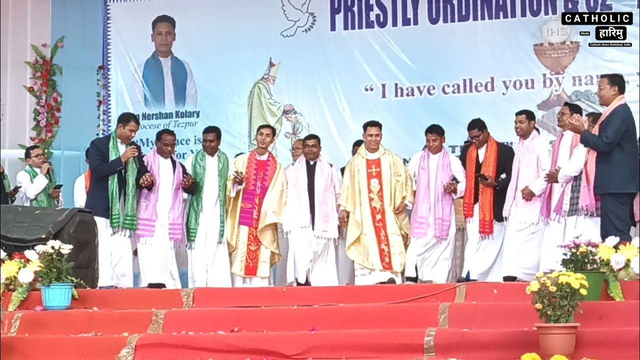 Catholic priests dancing with the two newly ordained priests at Udalguri Parish Auditorium