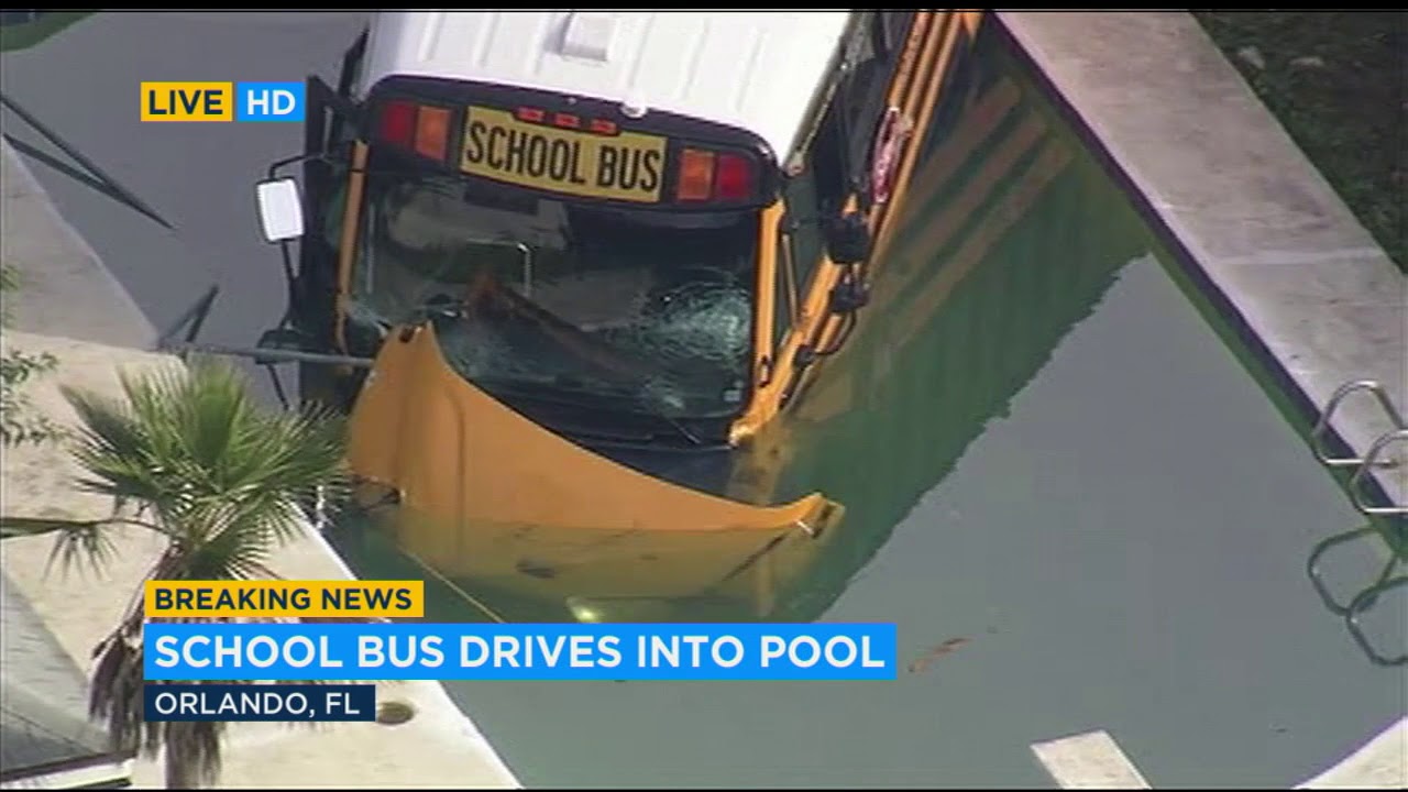VIDEO: School bus ends up in backyard swimming pool after crash near Orlando | ABC7