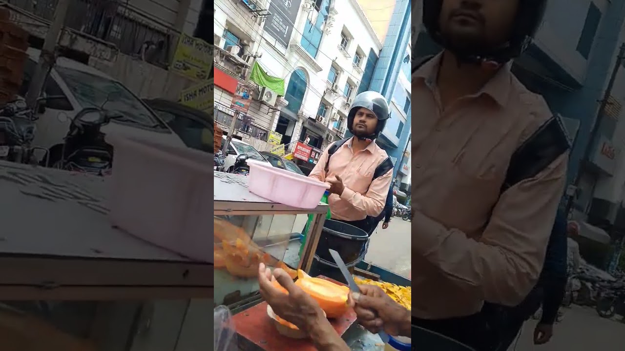 Older man selling papaya, the real Hero at this age . 