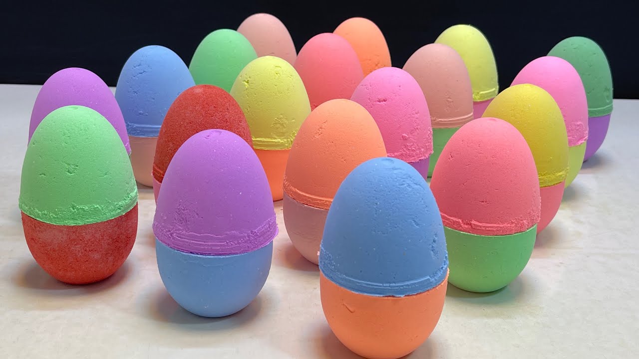 Crushing rainbow colored baking soda eggs