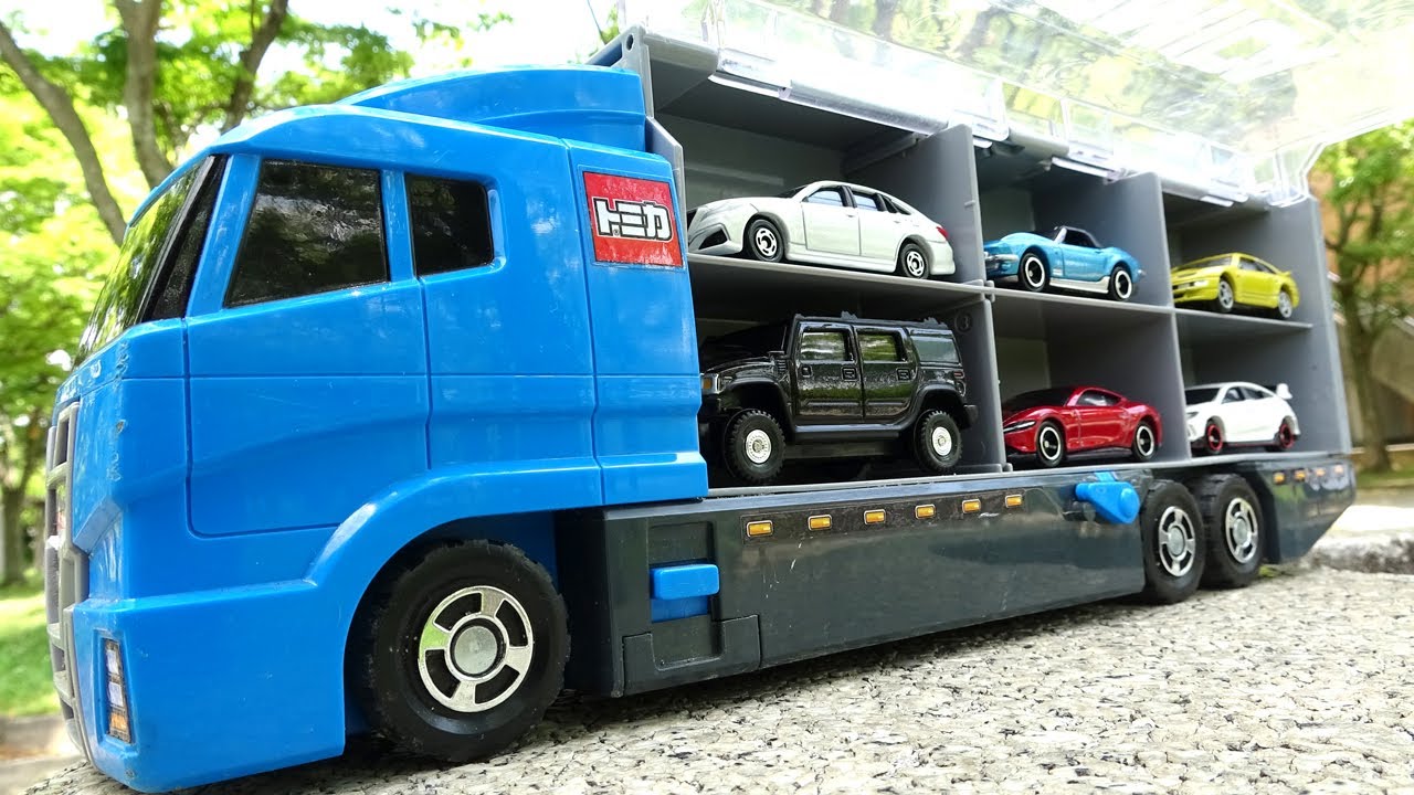 13 introduce cars and store them in a blue truck.