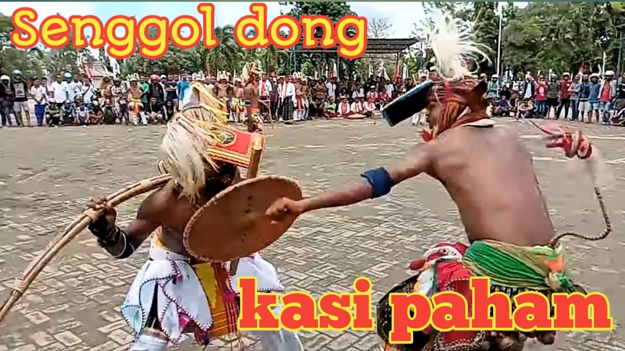 part 1. Menantang lawan sampai nyerah.  bermain caci / caci Dance Rickar Santos