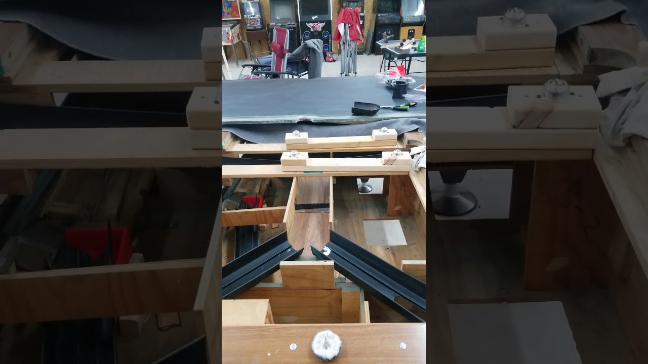 Coin operated pool table  magnetic ball return