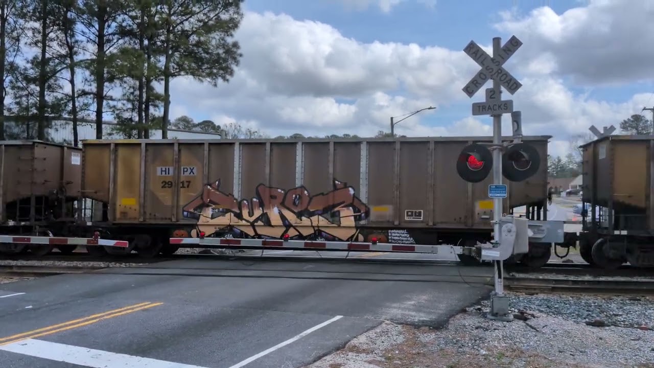 CSX 7089 and CSX 258 lead a north bound empty coal train across Whitfield Street in Fayetteville