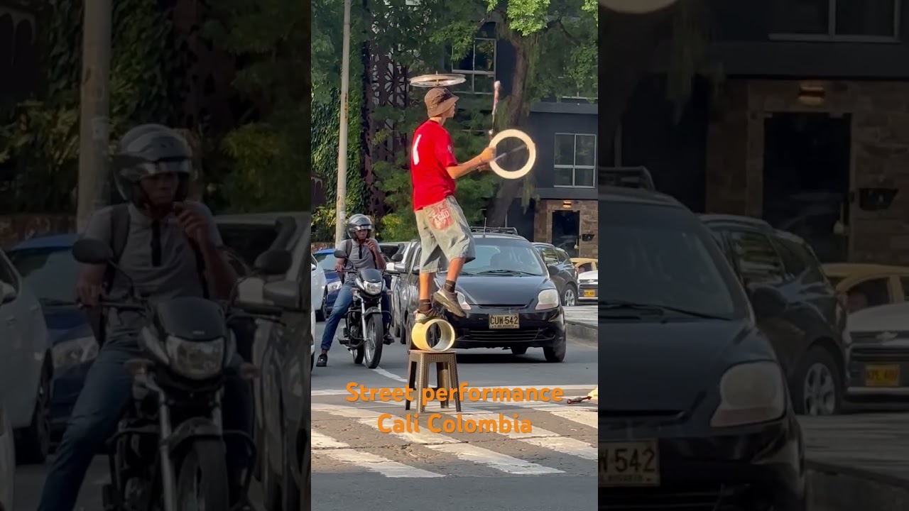 Performer cheers up drivers at the traffic stop Cali Colombia 