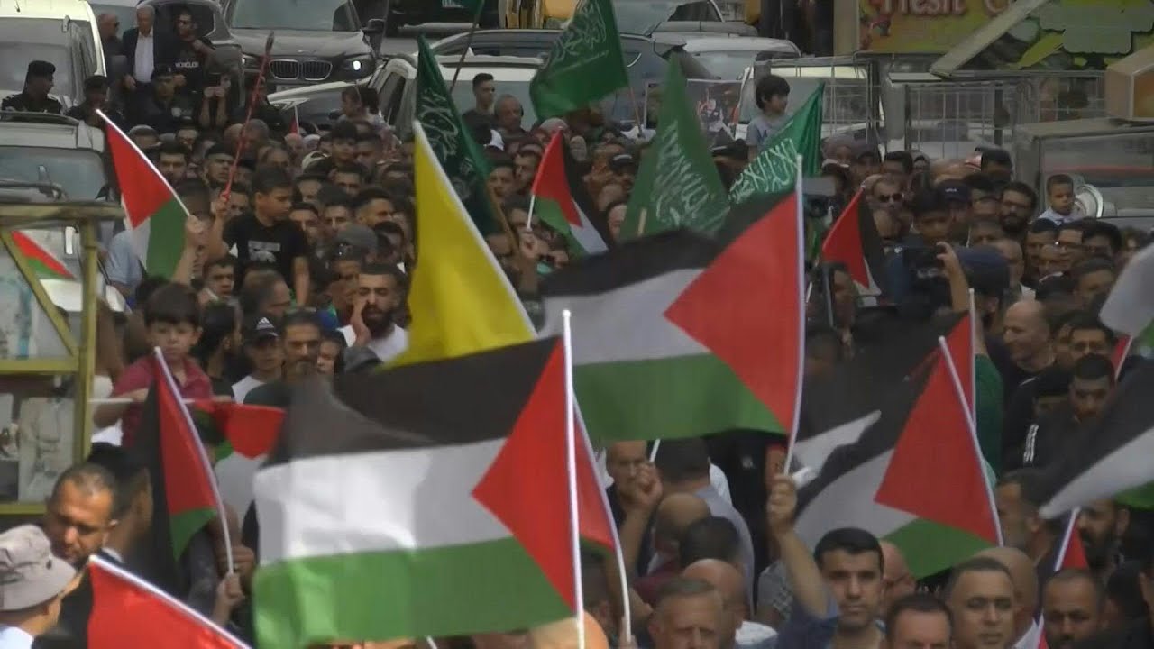 Palestinians rally in Ramallah in support of Gaza, holding Hamas flags | AFP