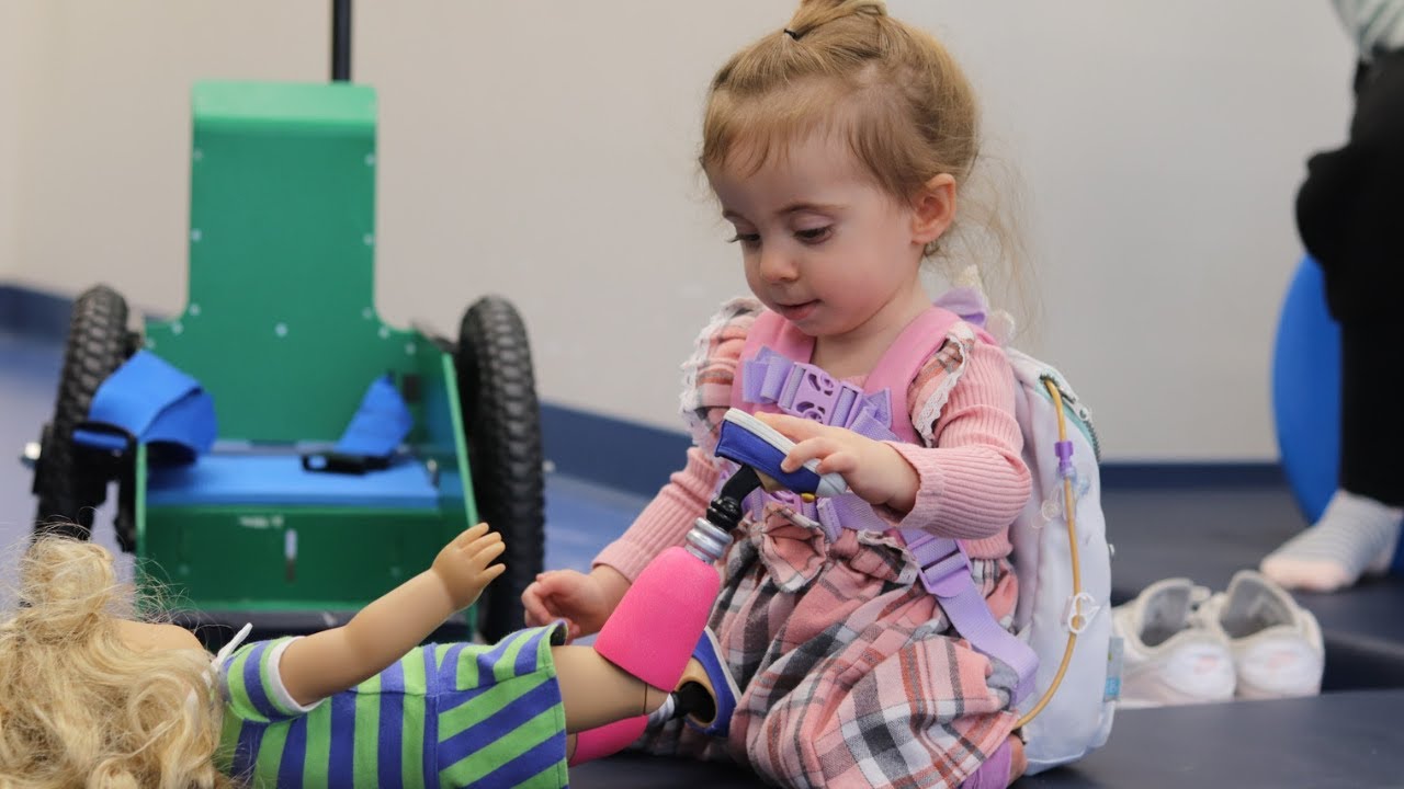 Young girl with artificial legs gifted a doll in her own image