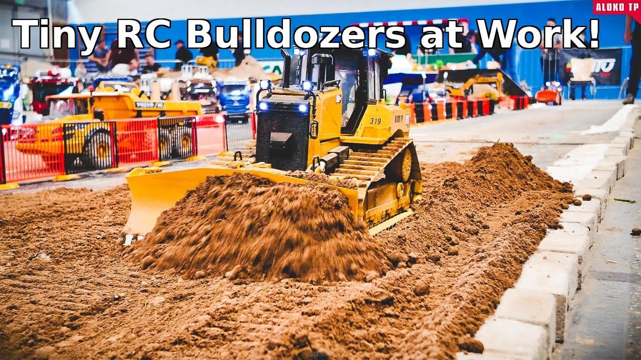 Watch These Tiny Bulldozers Move Mountains of Dirt!