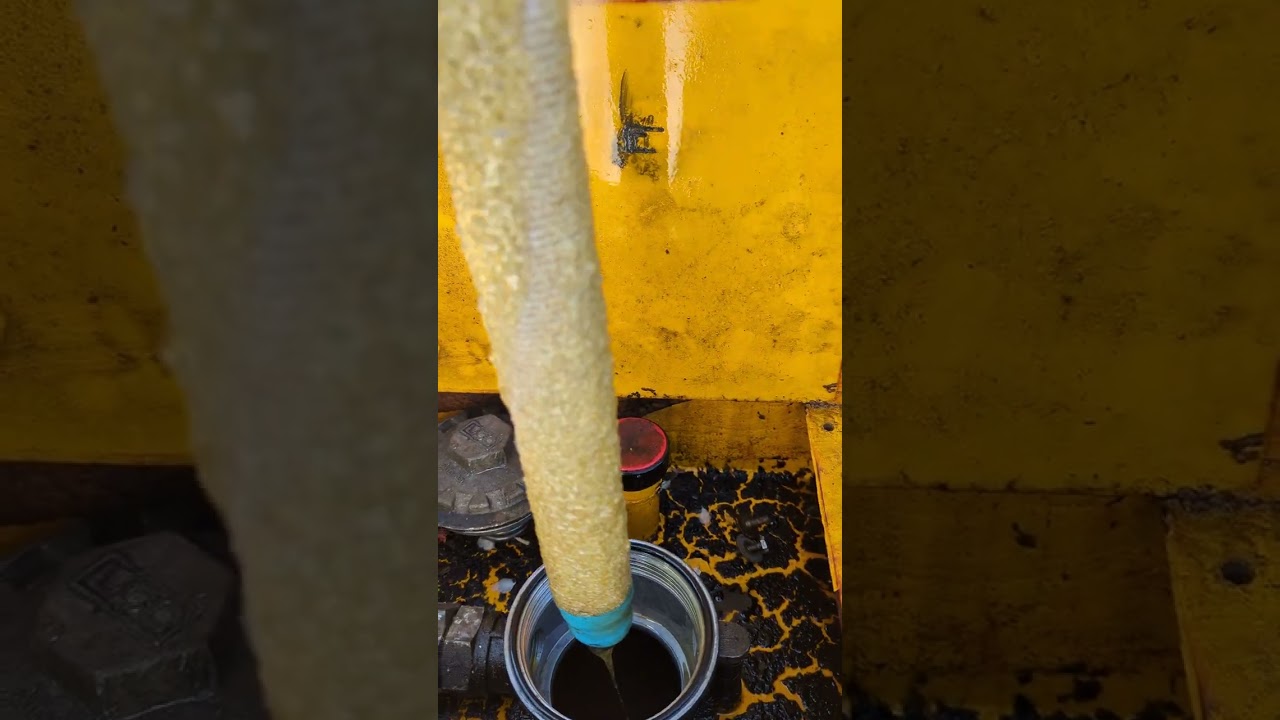 Removing water from emulsified hydraulic oil without draining.