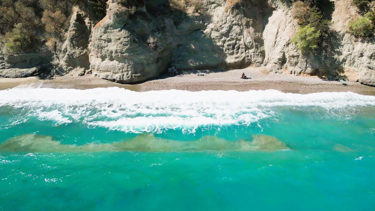 Istron Bay (Pylos beach), Mirabello Bay, in Agios Nicolaos, Crete, Greece, 4K DJI Drone Footage