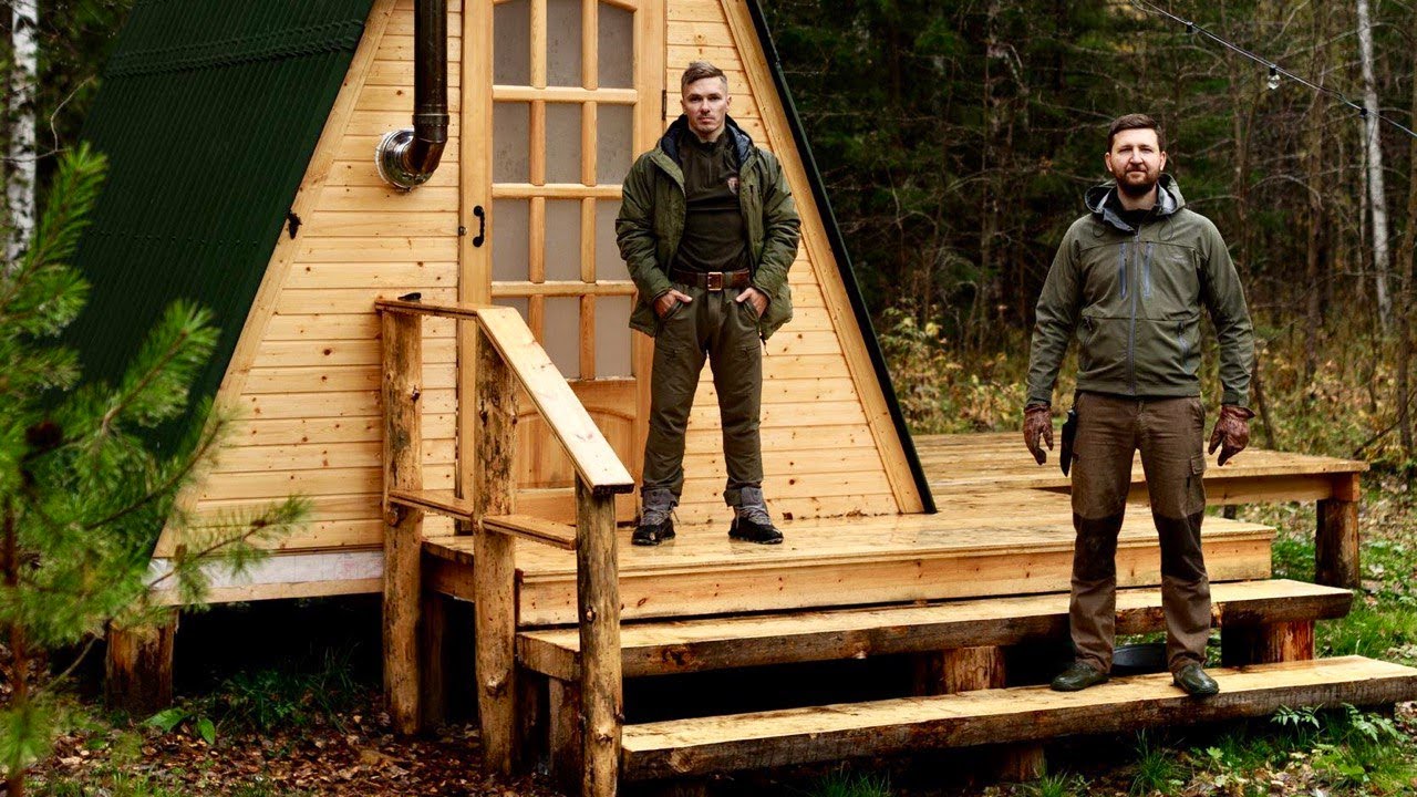 BIG A-FRAME BUILT. FOREST LAKE FILLED WITH WATER