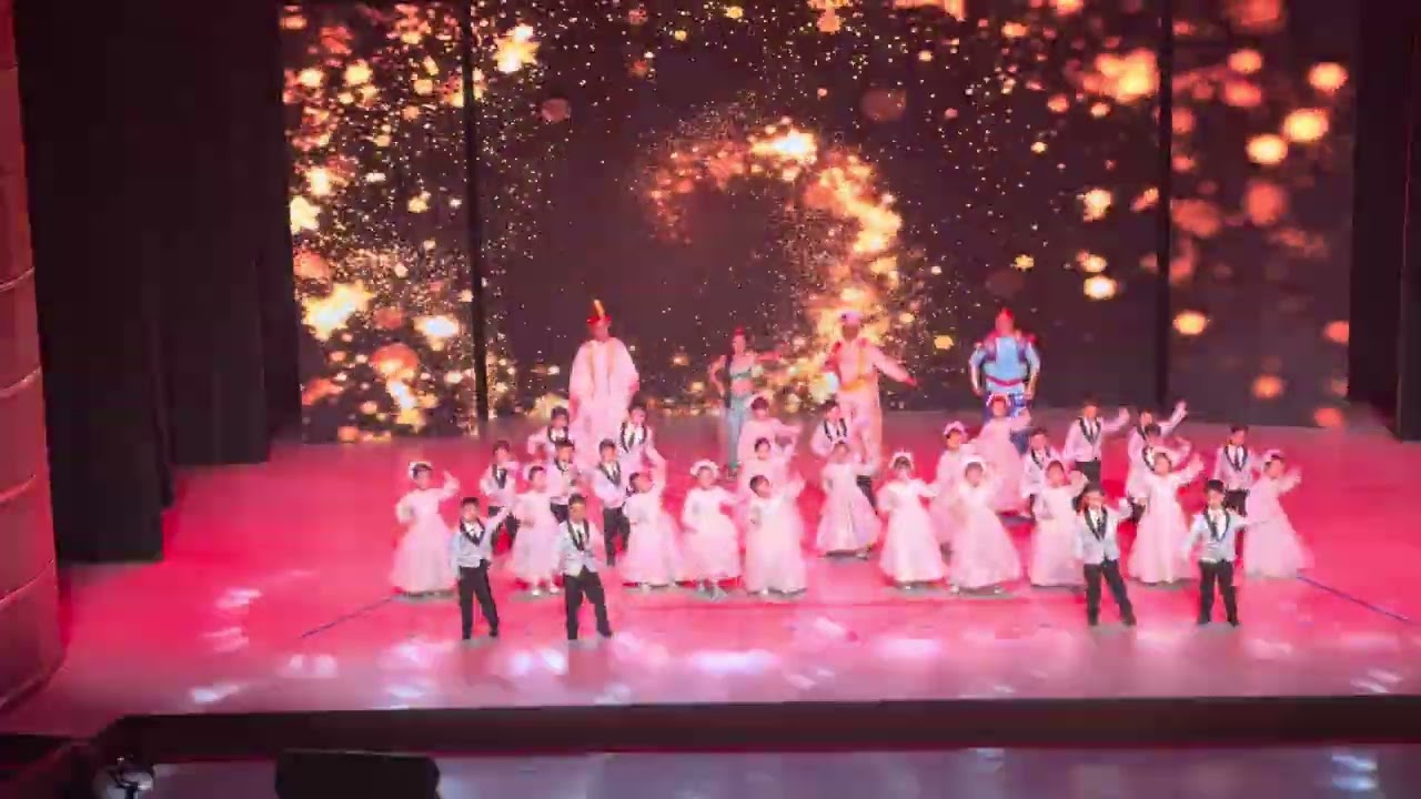 The kindergarten performance featured a little baby dancing energetically