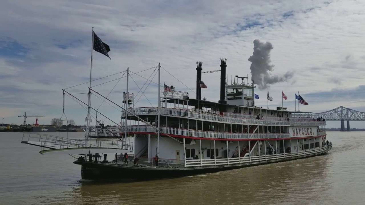Steamboat Natchez blows her whistle arriving into her berth