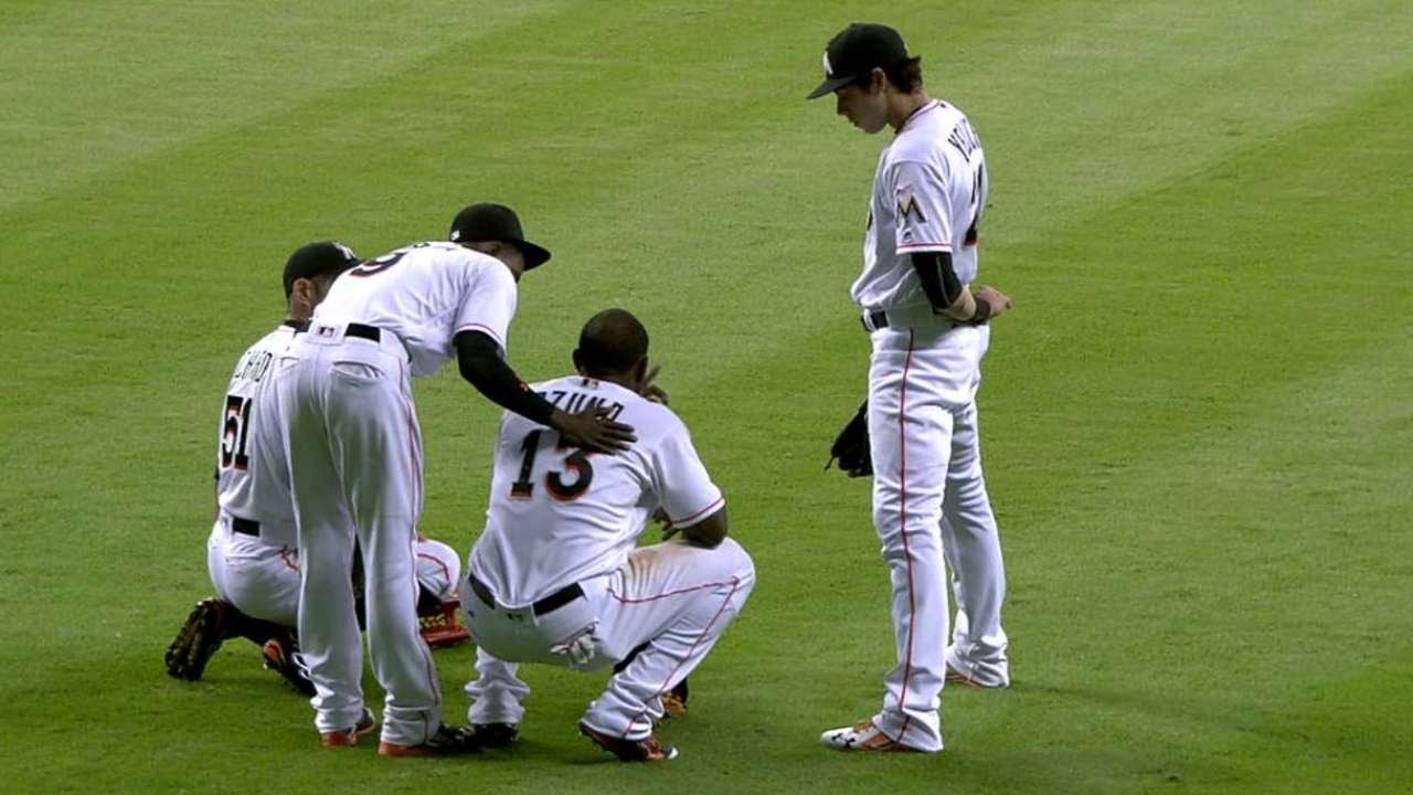 KC@MIA: Ozuna leave game due to a family emergency