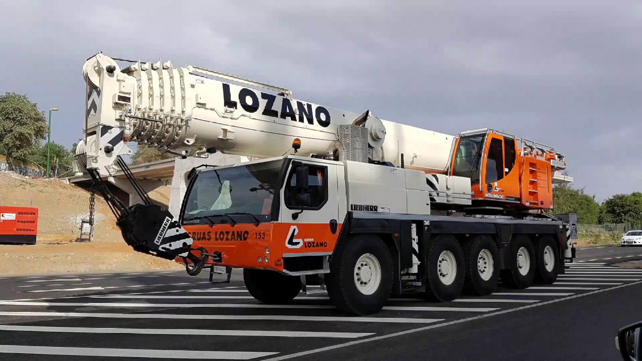 GRUAS LOZANO liebherr ltm 1130 5.1 + demag ac200. Montaje de pasarela peatonal