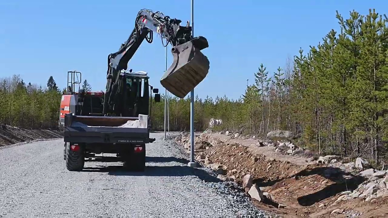 ATLAS 140W with Engcon tiltorator and EMA grading bucket restore after digging fiber optics