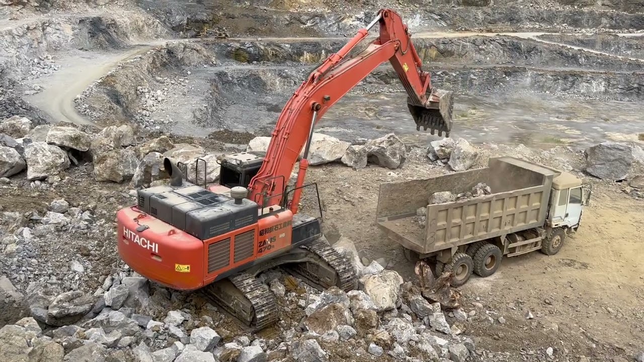 Hitachi Zaxis 470R Excavator is loading soil and rock on the mining area