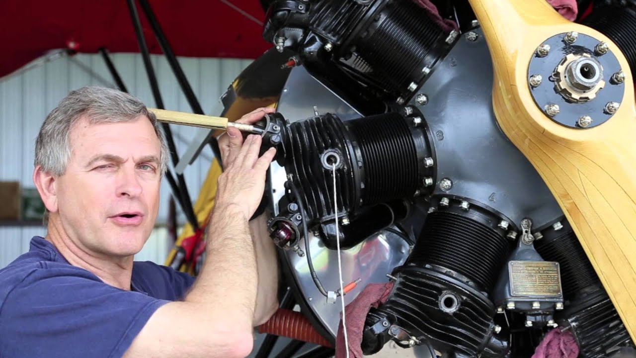 In The Hanger  with Jim Jones - Lapping an exhaust valve in place.