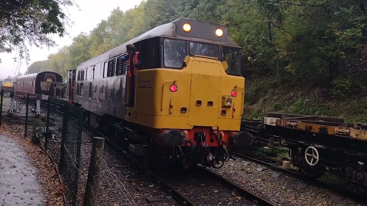 Here is grey and yellow class 31130 shunting out some rolling stock with 2 tone towards crossing 