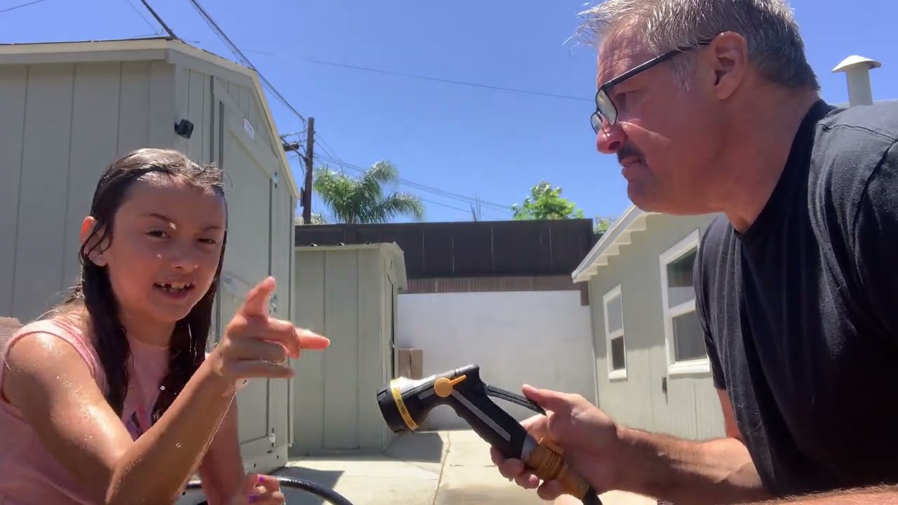 Washing my hair in backyard hose play￼