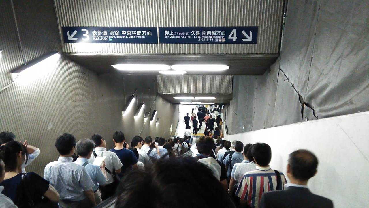 ORDERLY JAPANESE. long long escalator in the rush hours, Tokyo.