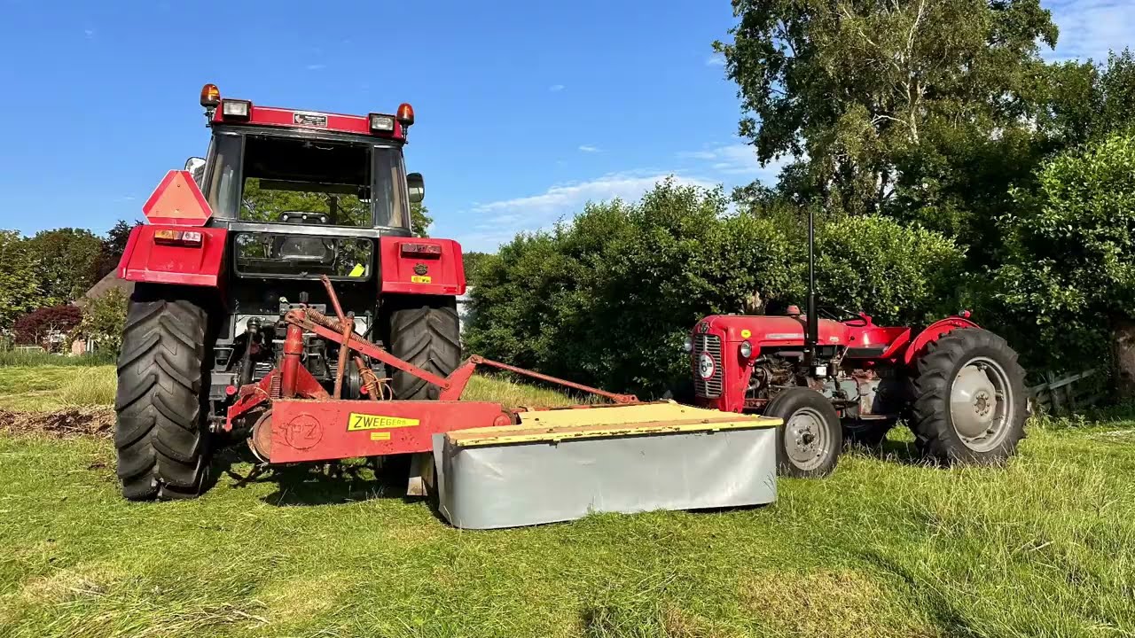 Case 845XL mowing with Pz165