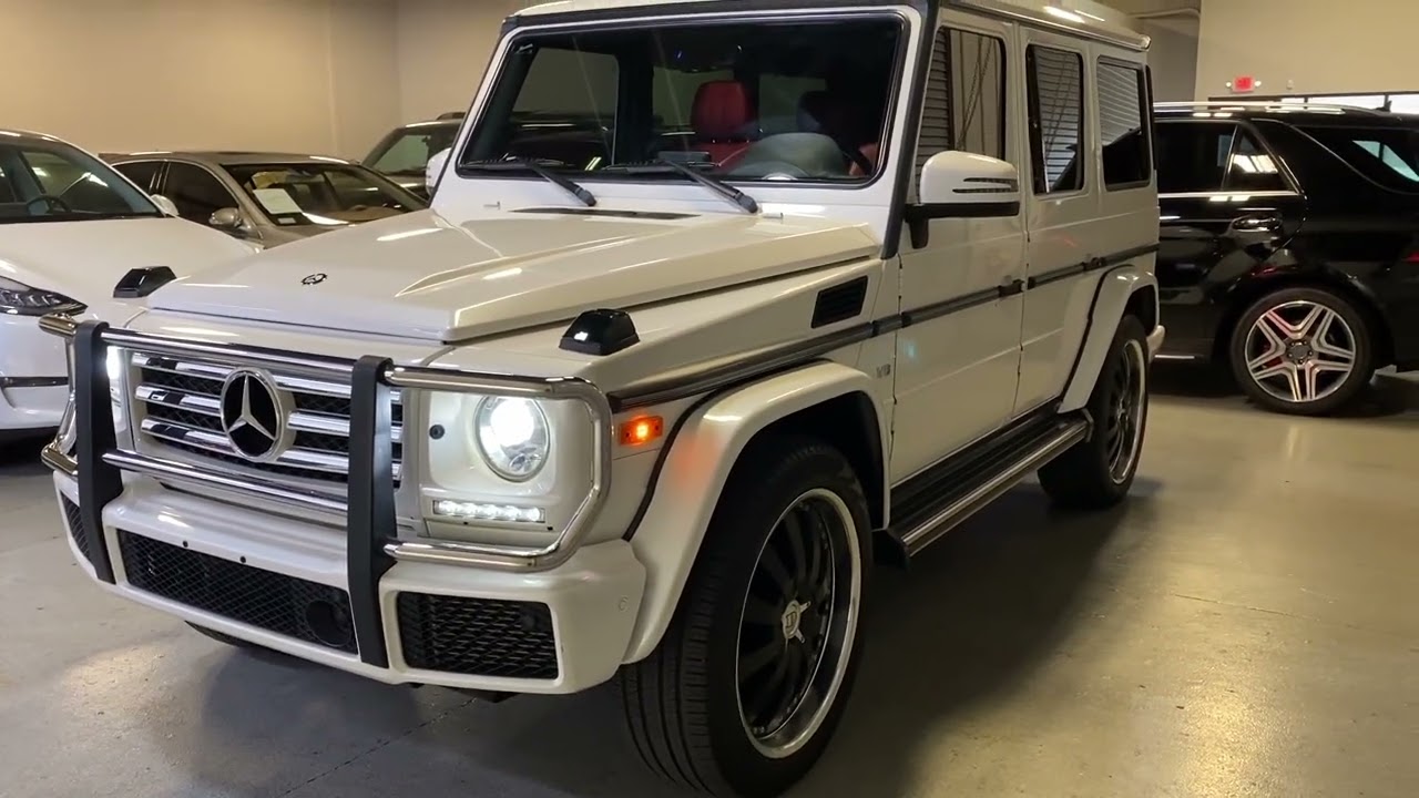 GORGEOUS 2016 Mercedes Benz G550 4Matic in Mystic White with Red LOW MILES Come see us in Scottsdale
