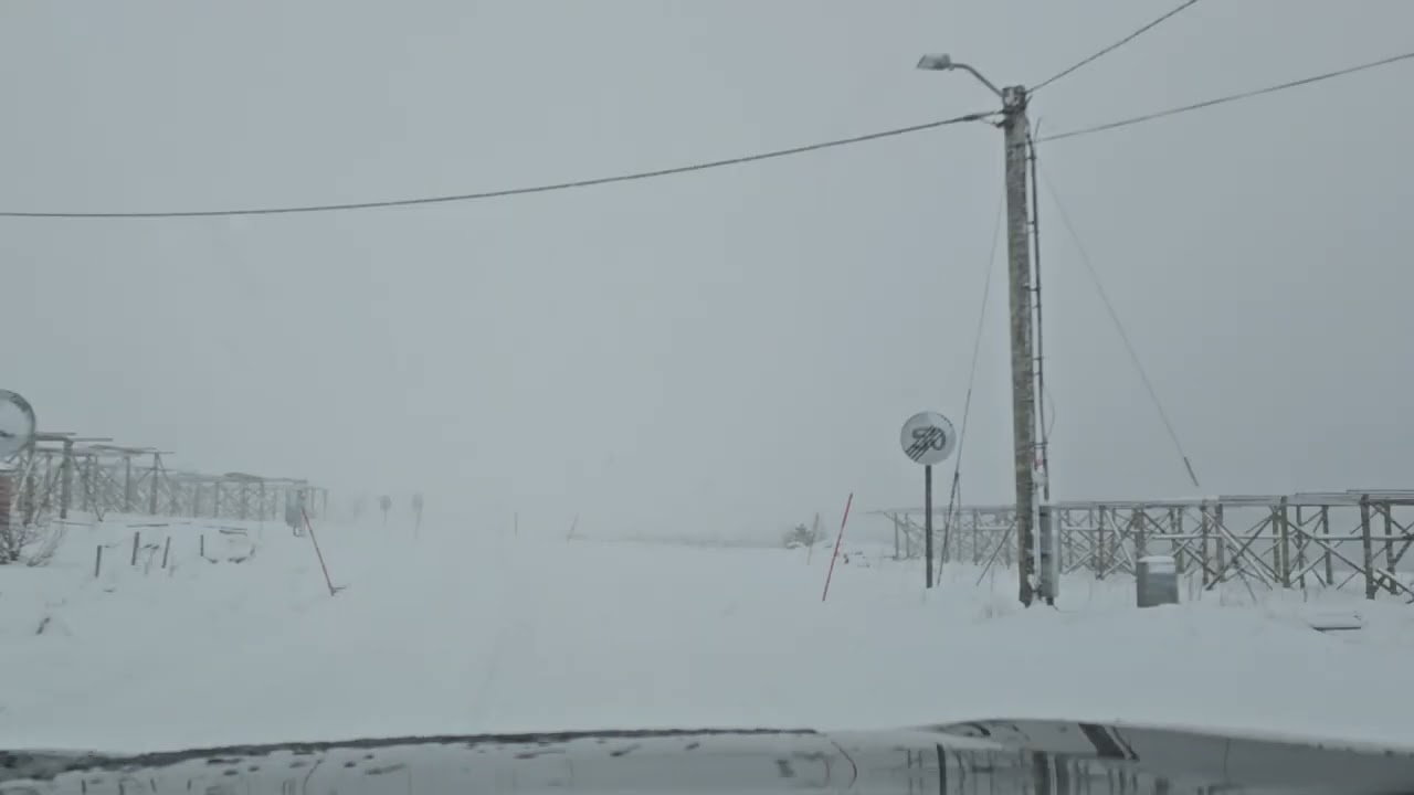 Hyperlapse of driving in Lofoten in February / winter: through a snowstorm to the sun at Fredvang