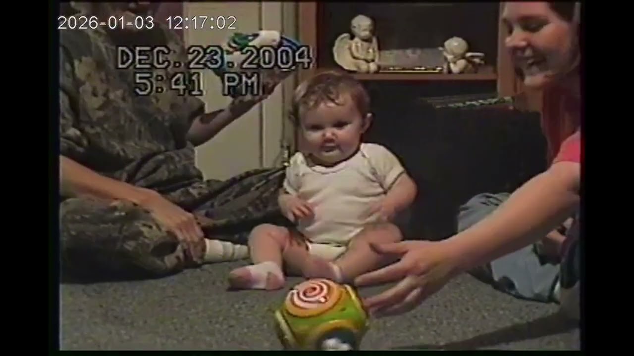 OUR LIFE! Christmas 2004 Reagan opening her gifts!