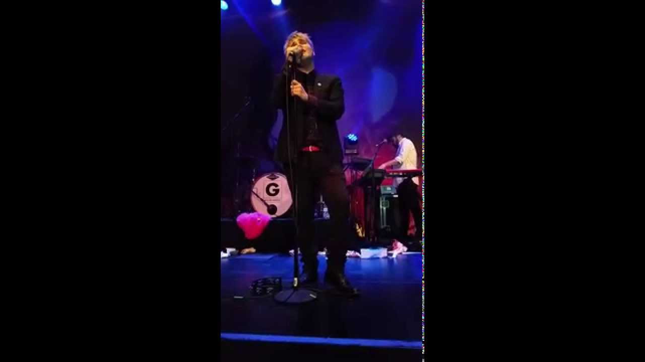 Gerard Way smiling while singing 