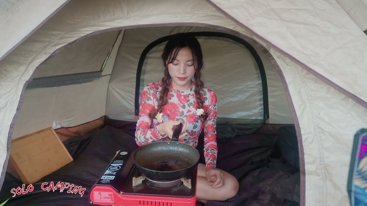 Solo Camping deep in the forest, relaxing with stunning mountain scenery on a sunny day