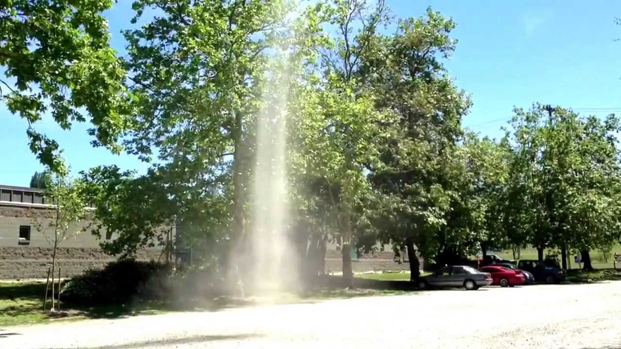Small dust devil in parking lot