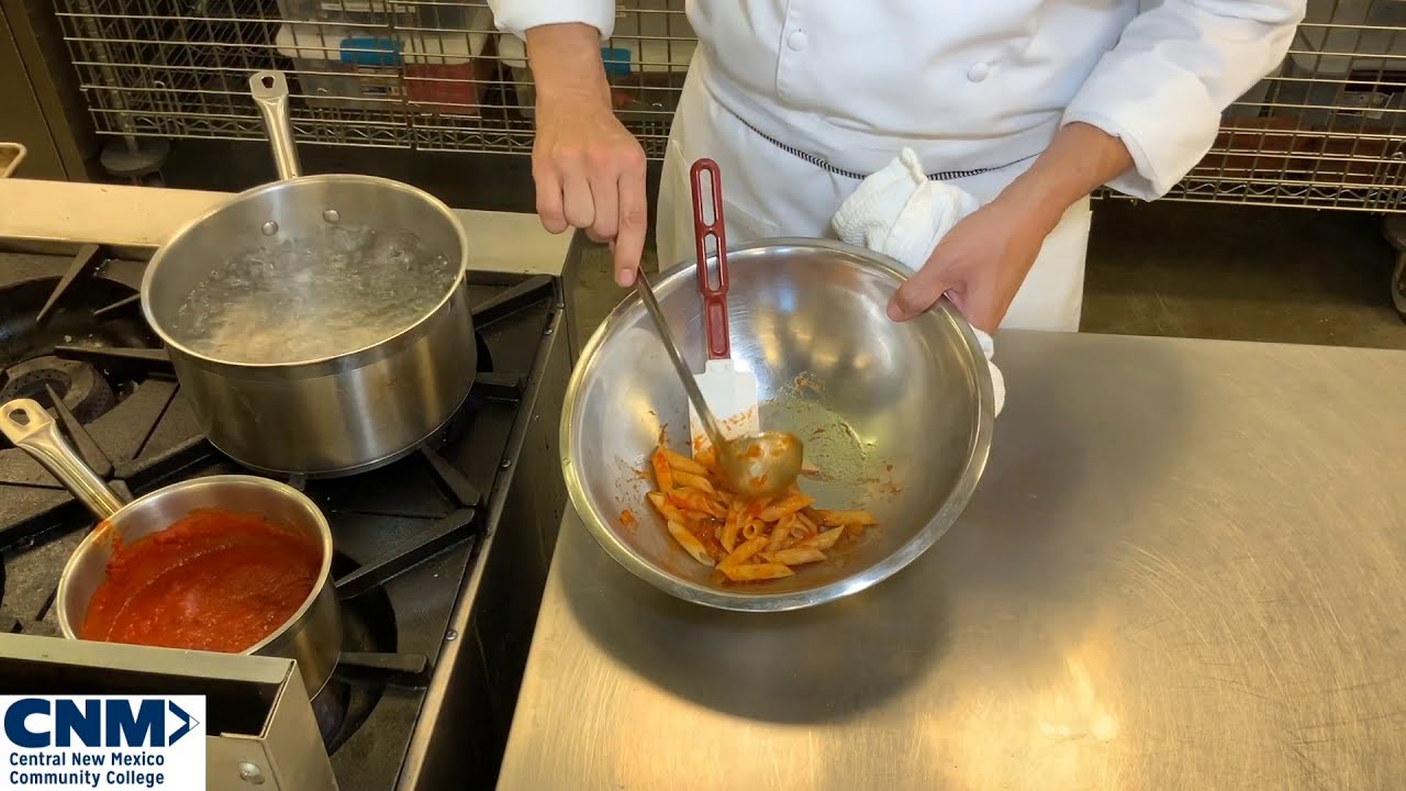 Tossing Pasta In Creole Sauce