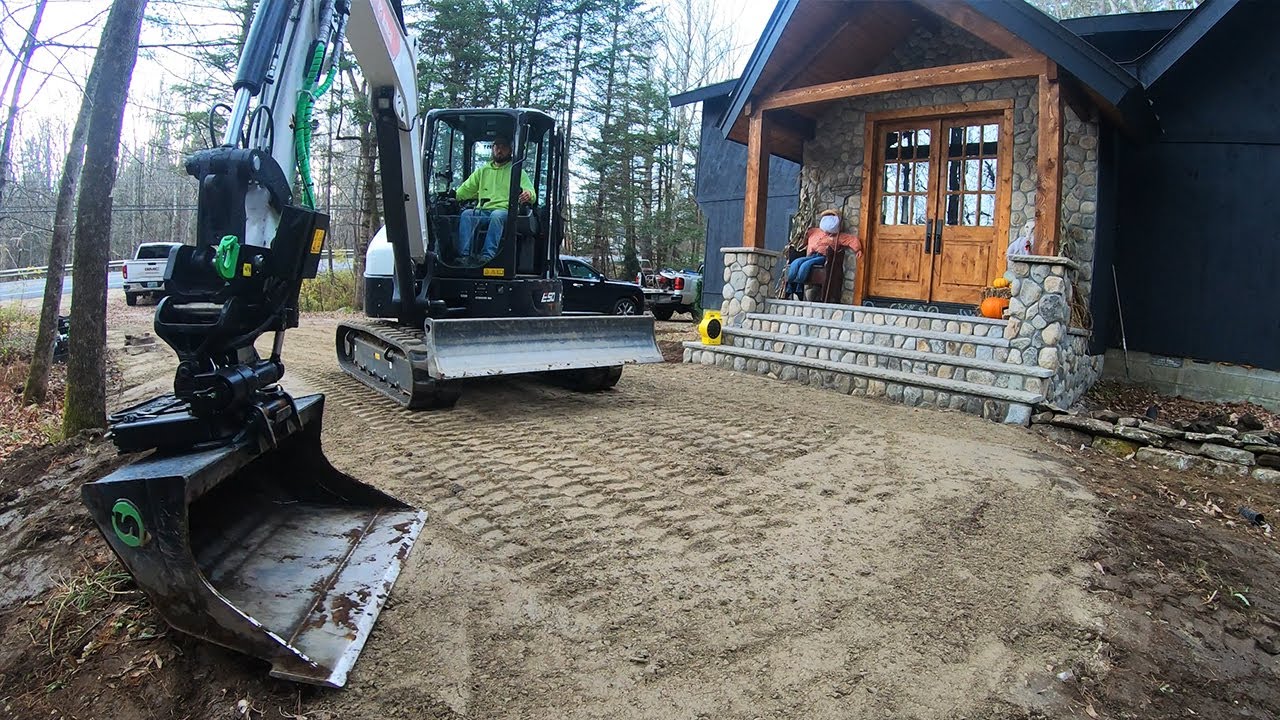Spreading Driveway Base and Building a Rock Wall with a Tilt Rotator