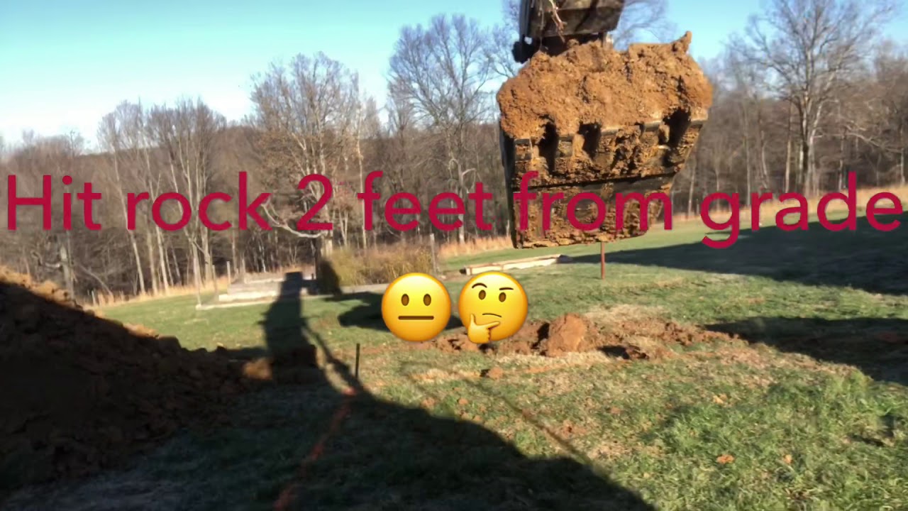 Digging basement hit rock with John Deere Excavator