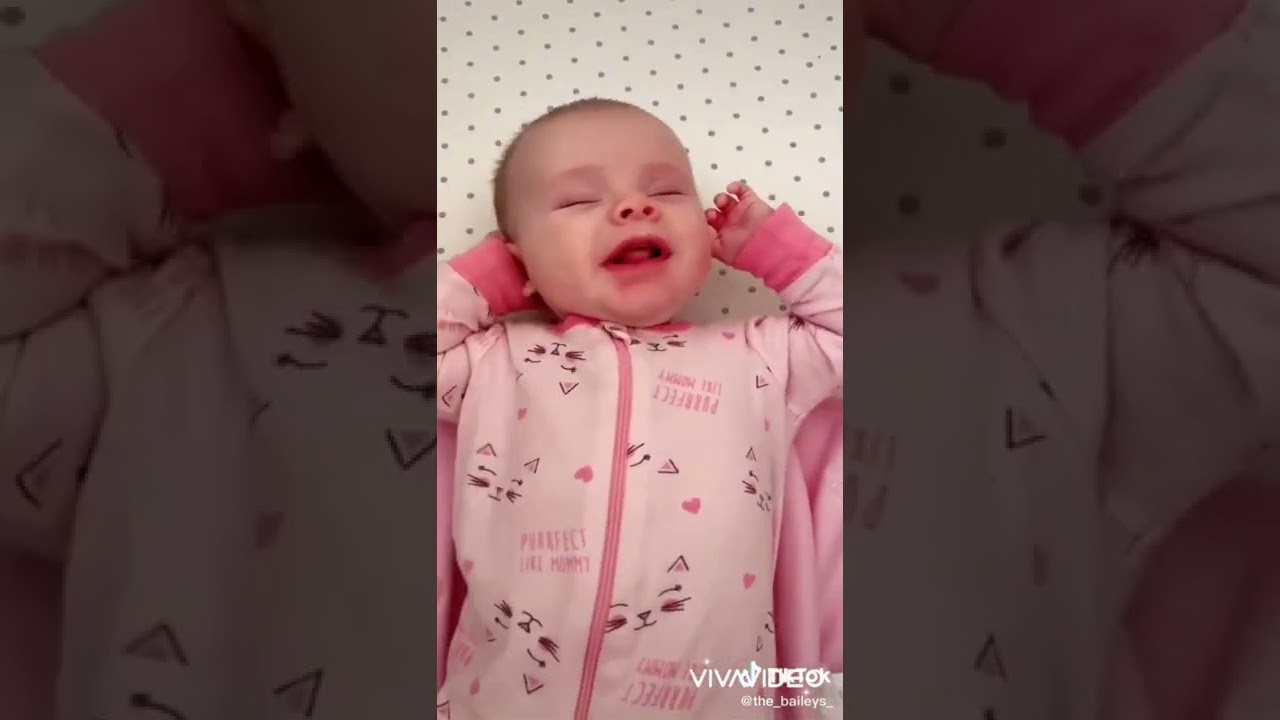cute baby stretch after swaddle