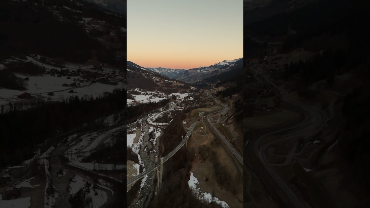 Snowy valley surprise: roads curve like ribbons 