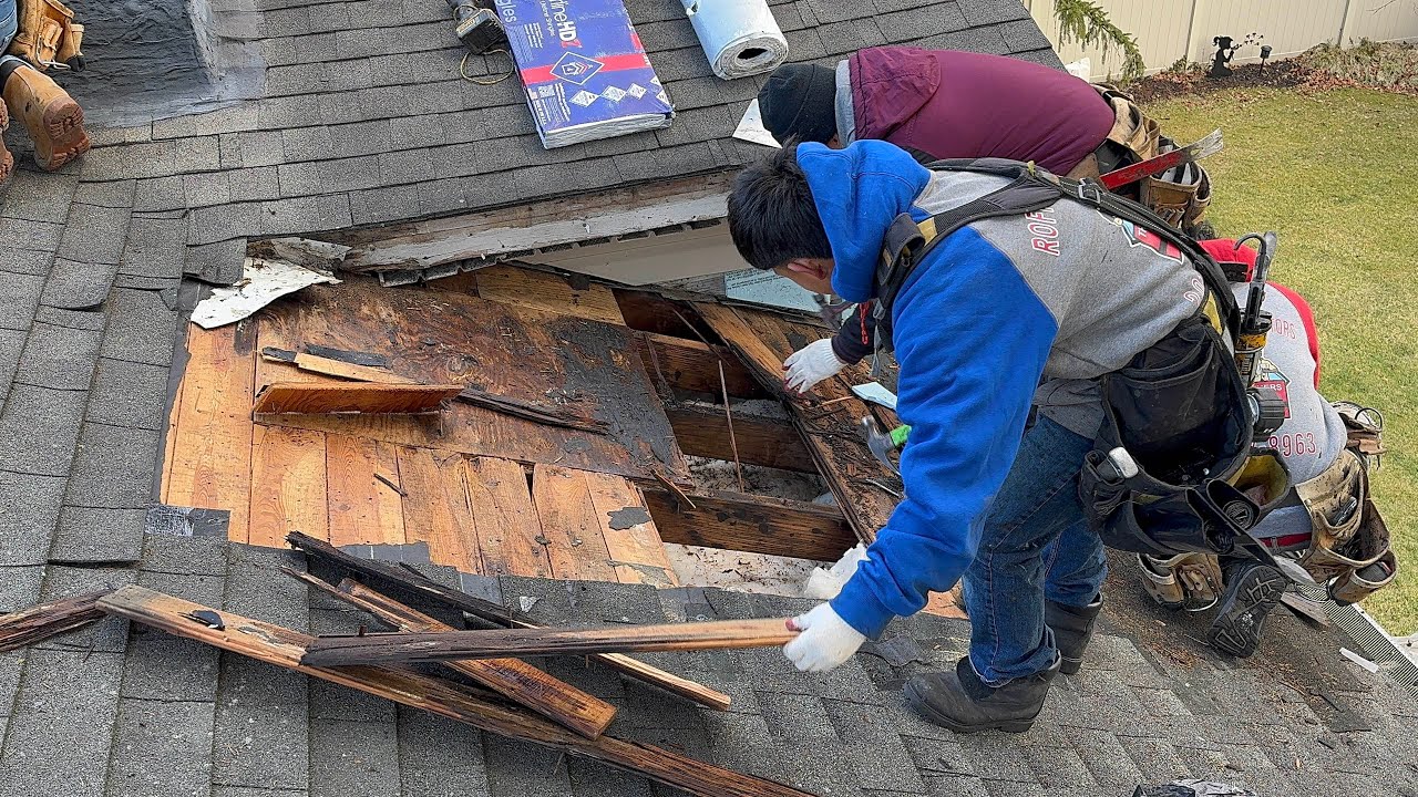 Asphalt shingles roof leak repair on valley