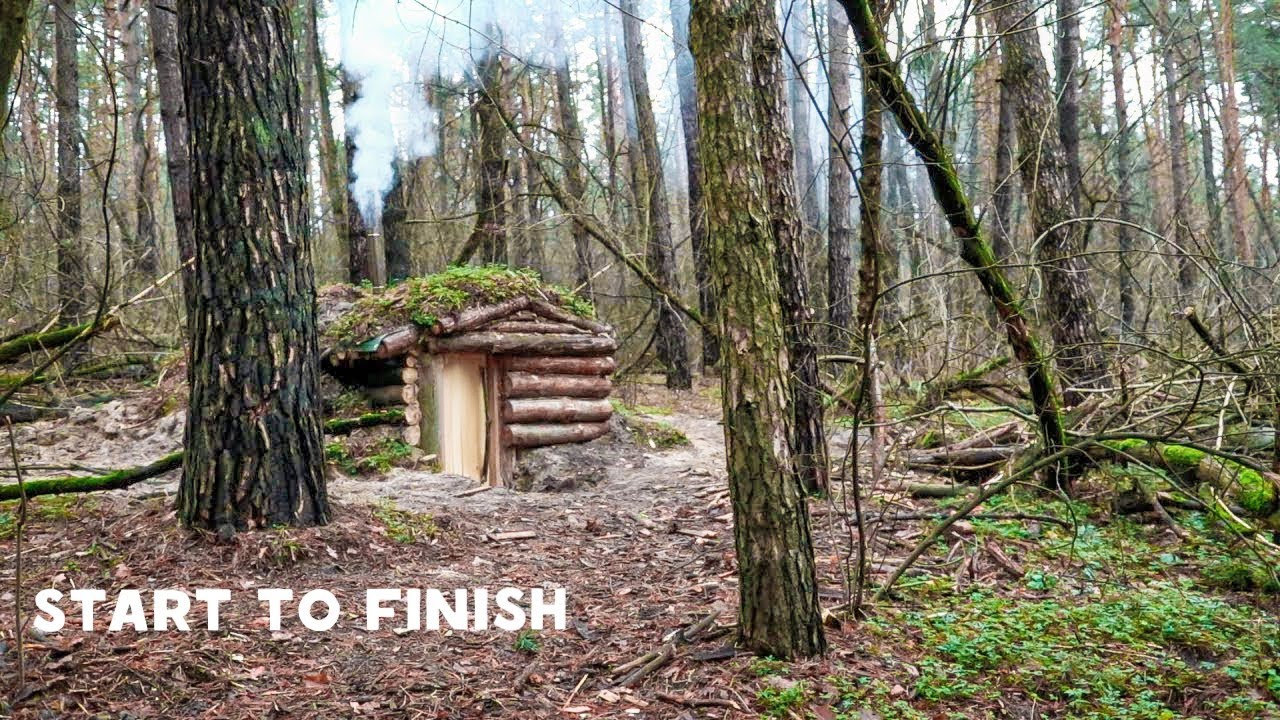 my first dugout bushcraft shelter , full build complete , week in dark wood , no talking