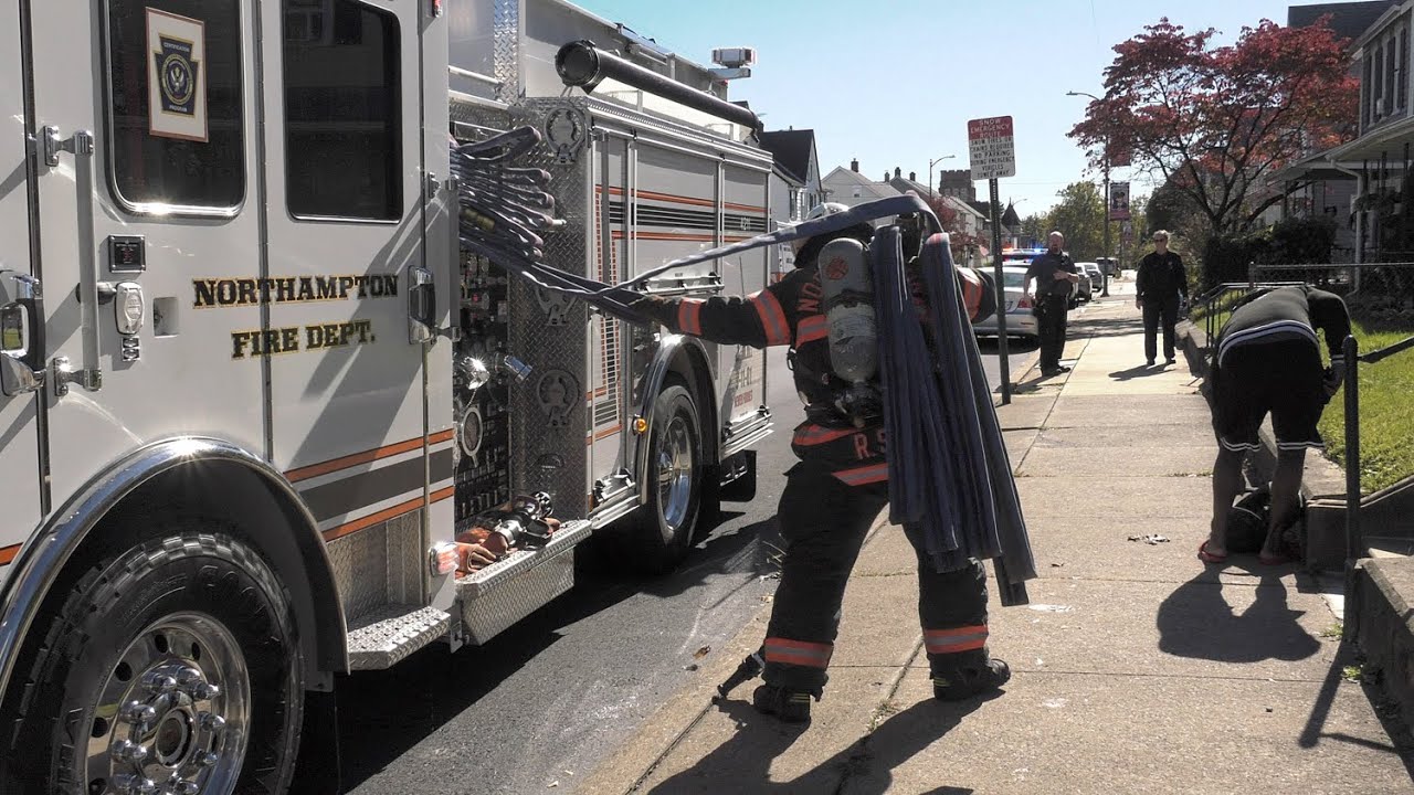 Fire Trucks arriving on Main Street for a house fire in Northampton, Pennsylvania