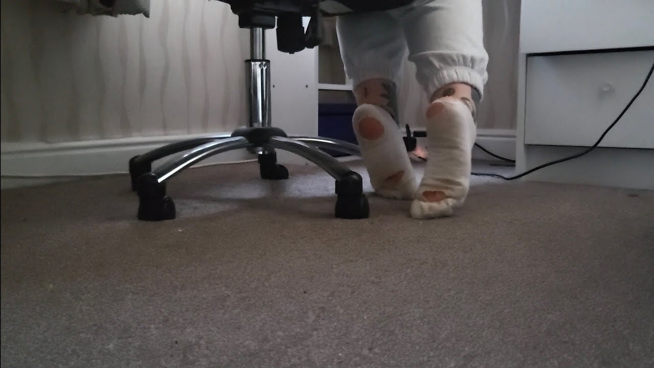 Girl rips dirty socks apart with her feet