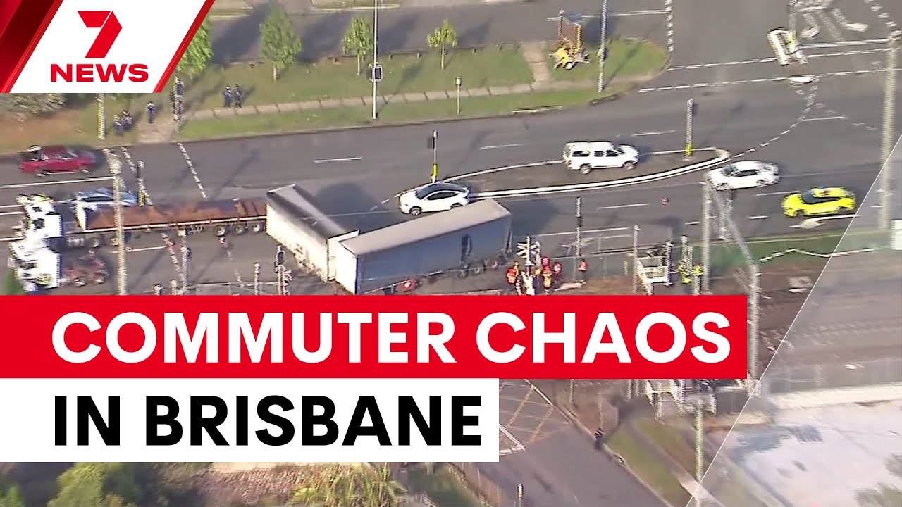 Train and truck collision disrupts Brisbane commute | 7NEWS