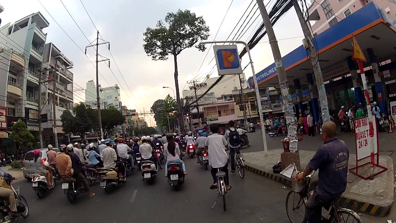 Scooter ride in Vietnam, Saigon (Ho chi minh city) in the afternoon