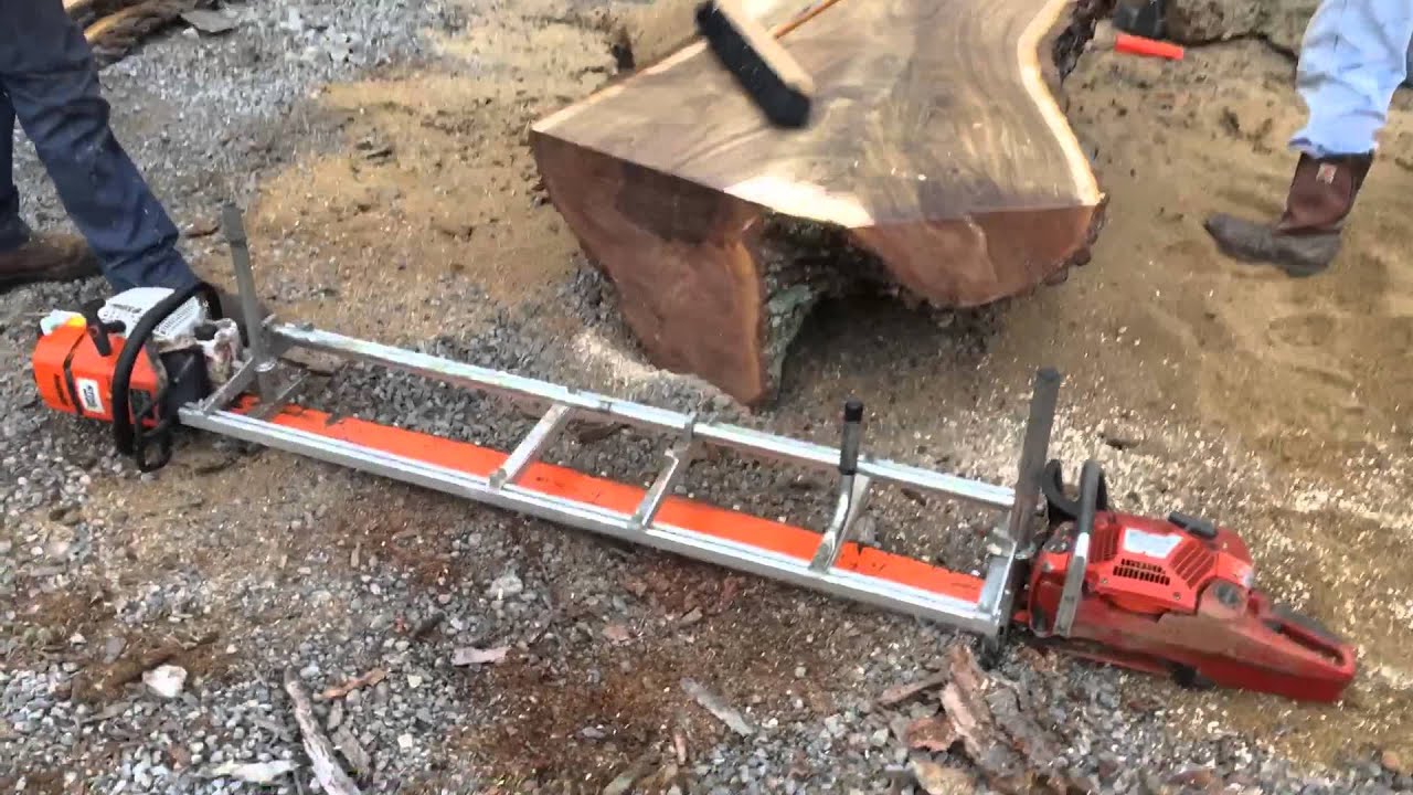 Live edge walnut wood slabs being cut with Alaskan sawmill at ohiowoodlands.com