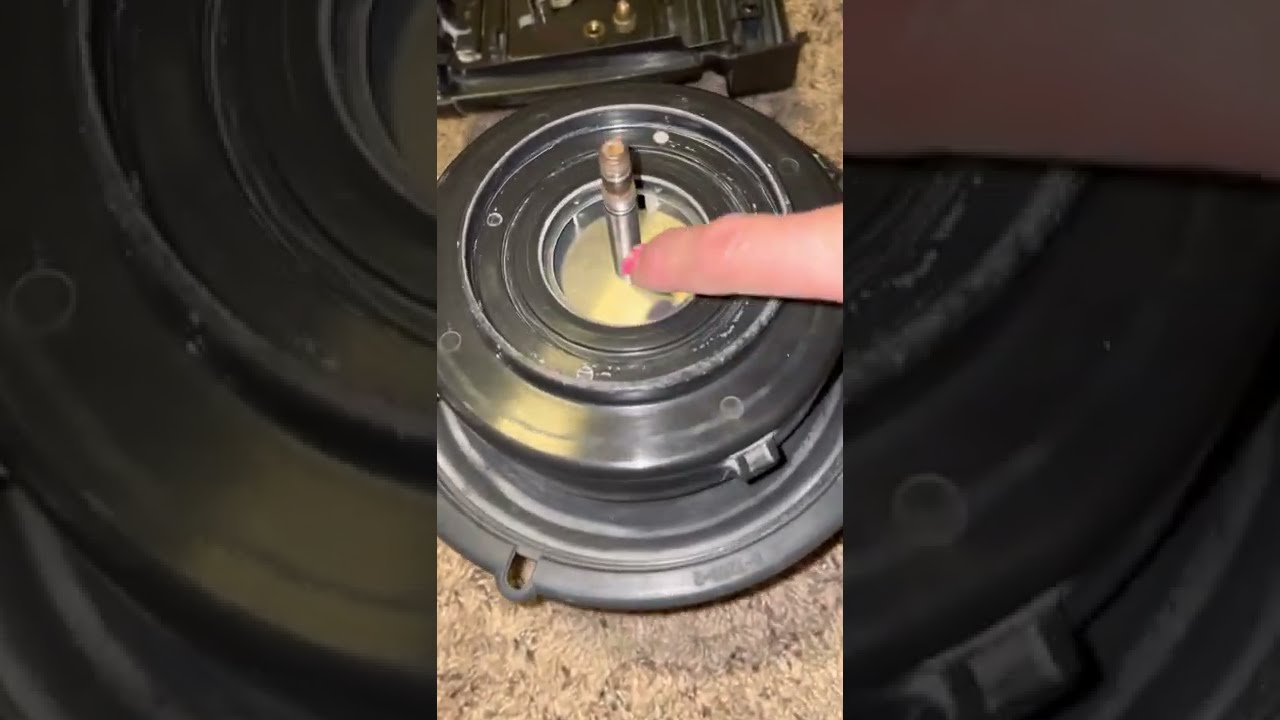Rebuilding fan blade assembly on a Rainbow Vacuum E-2 series and removing secondary shaft nut.