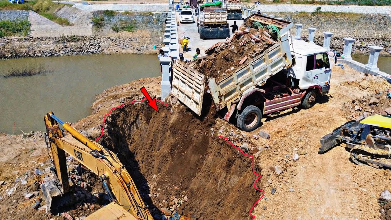 Amazing Filling soil near the stone bridge Using Bulldozer Komatsu with excavators Cat And Dump truc