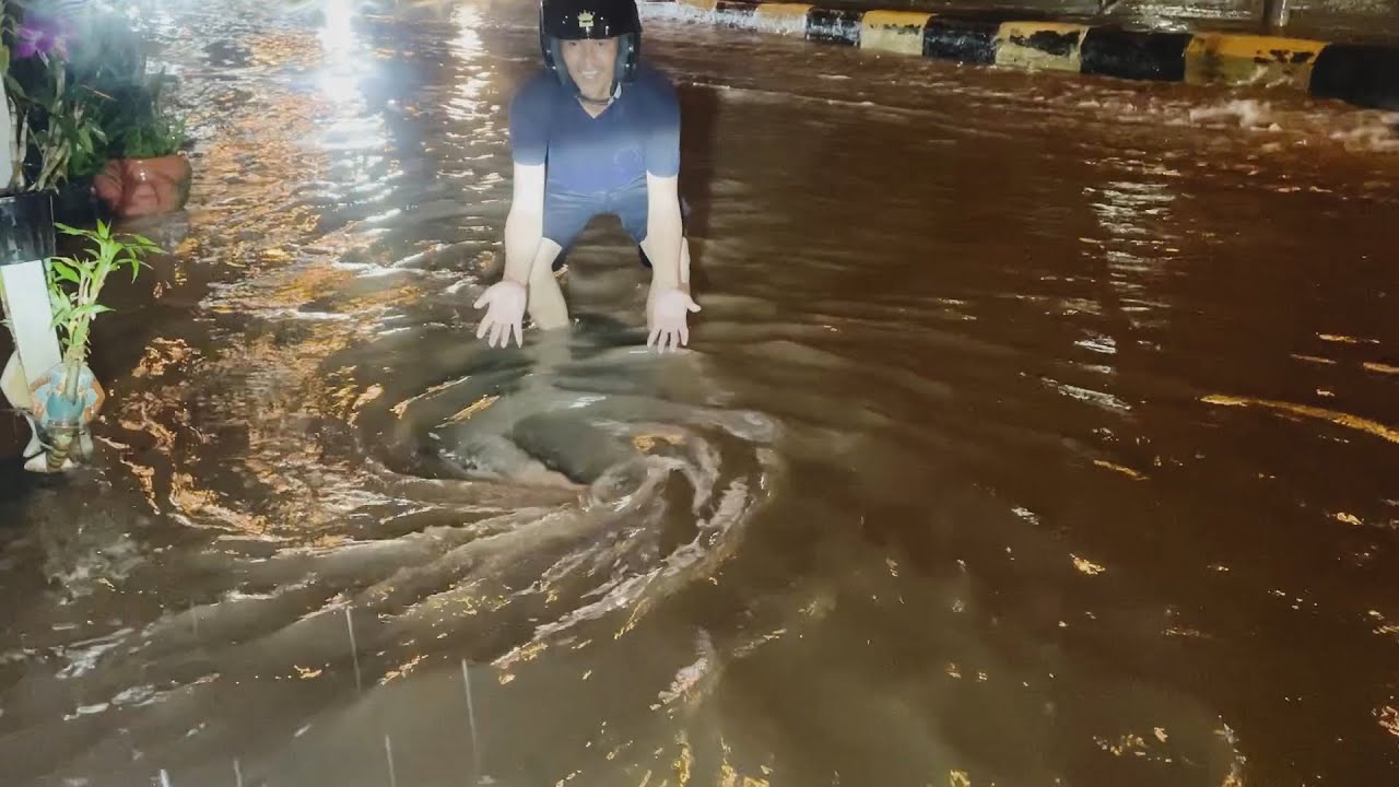 Massive flooding road, Remove plastic clogged drain culvert rain water